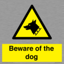 beware-of-the-dog-with-dog-warning-symbol~